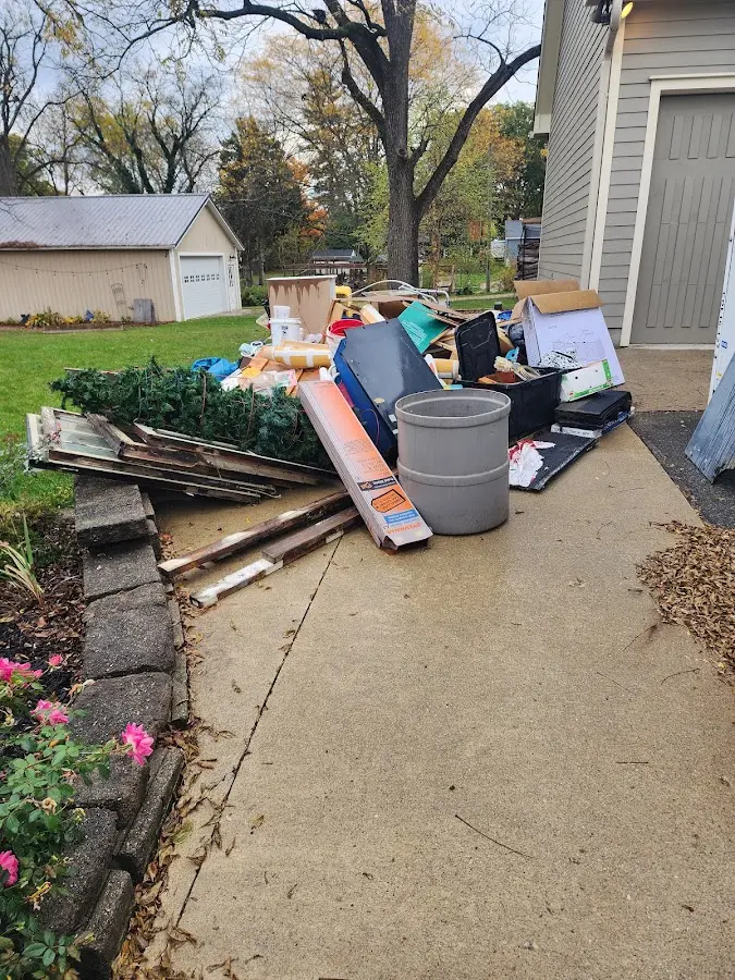 Dumpster being loaded with debris for 3 Yard Dumpster Rental in Wailuku